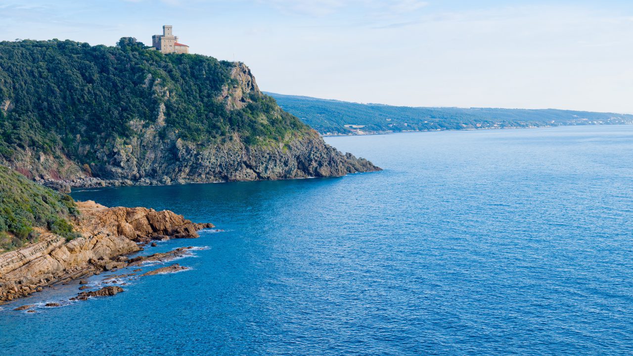 Romito, Toscana - Livorno, Tuscany, Italy: Beach and cliffs of Calafuria. The tower indicates the cliff under the Aurelia bridge: a beautiful sea, a classic diving destination.