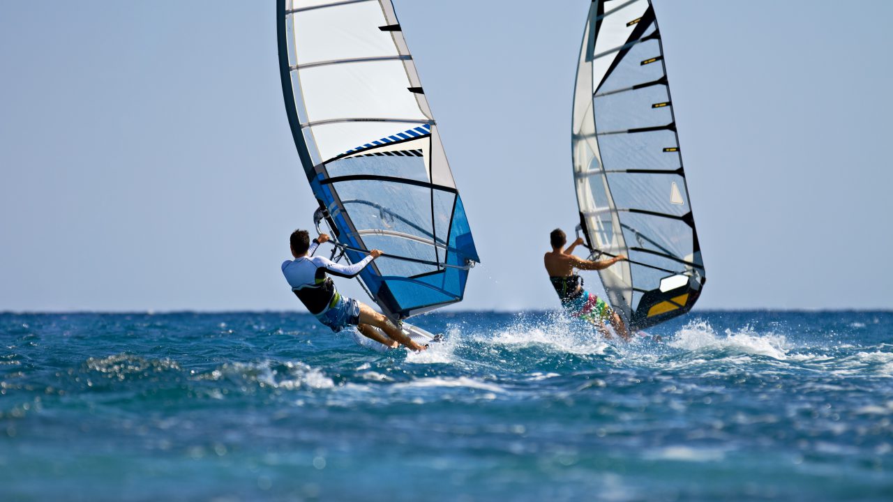 Windsurf - Windsurfers in action on bright sunny day